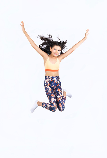 Girl jumping in sportswear