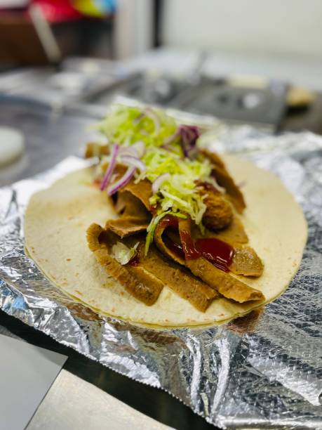 istock Doner in a wrap with salad and sauces 1396379482