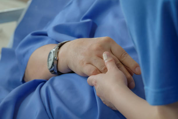 istock Human hand supporting a sick family at Hospital. 1396382349