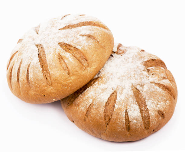 istock Traditional homemade round bread isolated on a white background 1396383645