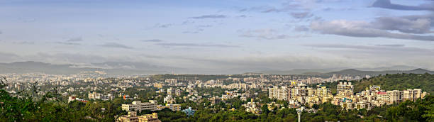 istock Early morning panorama image of fast developing city with many tall buildings and nice blue sky background. 1396383838