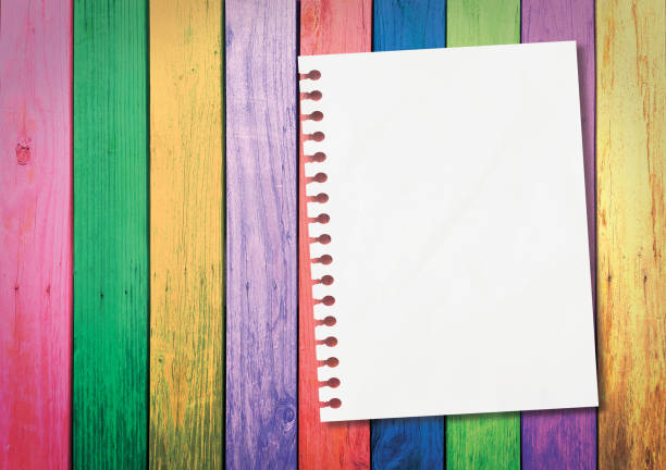 white paper on colorful wooden planks