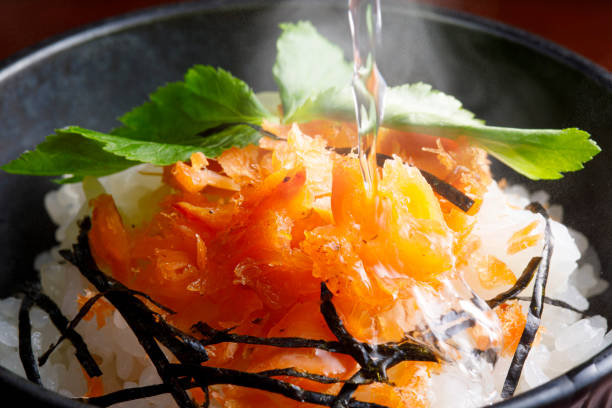 Serve side dishes over rice and pour dashi, Japanese tea, or hot water.