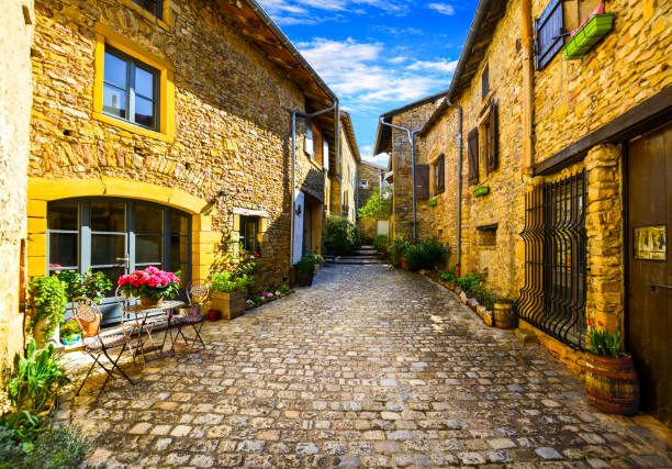 Oingt village in Beaujolais land and his small steet Oingt village in Beaujolais land and his small steet beaujolais region stock pictures, royalty-free photos & images