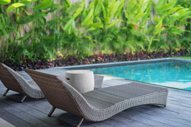 istock Empty Sun Lounger at a Poolside of a Holiday Villa 1396387139