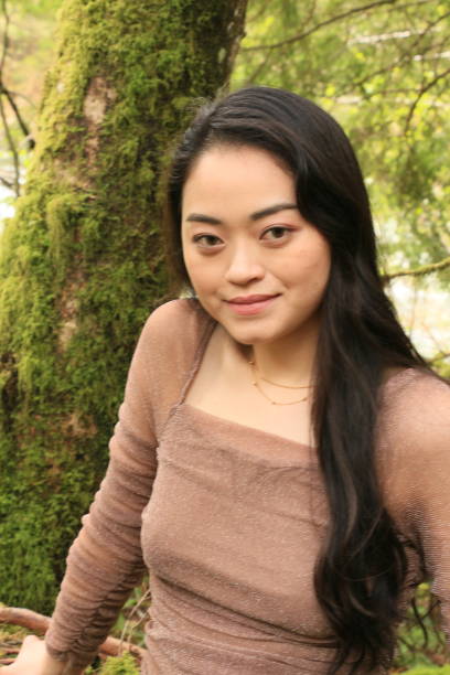 istock Happy Woman in Forest 1396387261