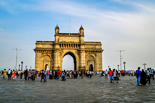 Mumbai, Maharashtra, India-April 19th, 2022: Crowd in front of Gateway of India historical monument in Mumbai with nice blue sky background.