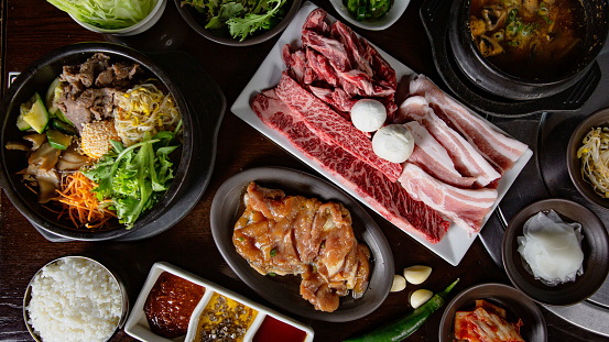 Top view of Korean Grilled BBQ combo sets on the traditional grill table
