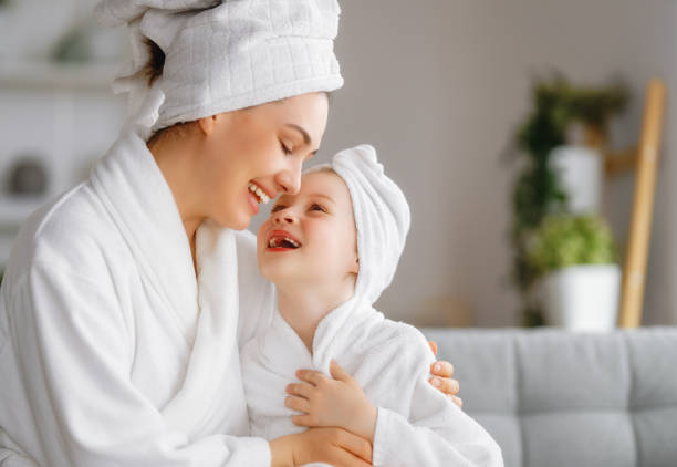 istock Mother and daughter after a bath 1396390249