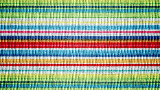 Multi colored striped cotton fabric background texture