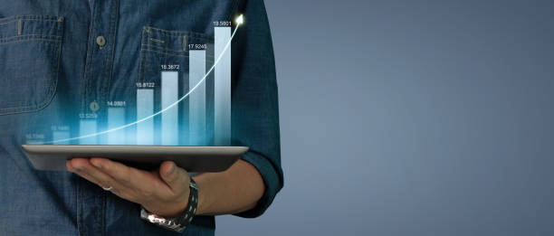 istock Businessman plan graph growth increase of chart positive indicators on tablet in hand 1396397342