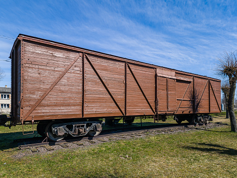 Skrunda, Latvia - April 20, 2022:  Memorial wagon, museum near station Skrunda, Latvia. Train wagon with in 1941 and 1949 deported Latvian people to Siberia.