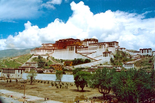 The famous Potala Palace.The residence and office space of the successive Dalai Lamas.Starting In the autumn of 1995, there was a huge square under the Potala Palace.\nIn August, the square is still a construction site.Film photo in 1995's Lhasa