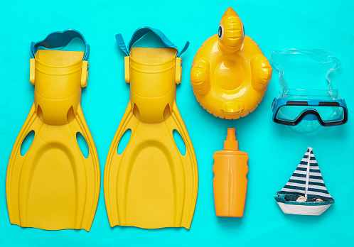 Beach accessories on blue background. Top view. Flat lay
