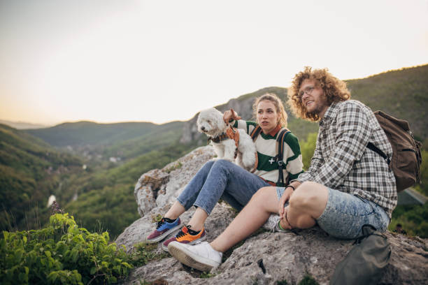 istock Couple relaxing on mountain 1396401670