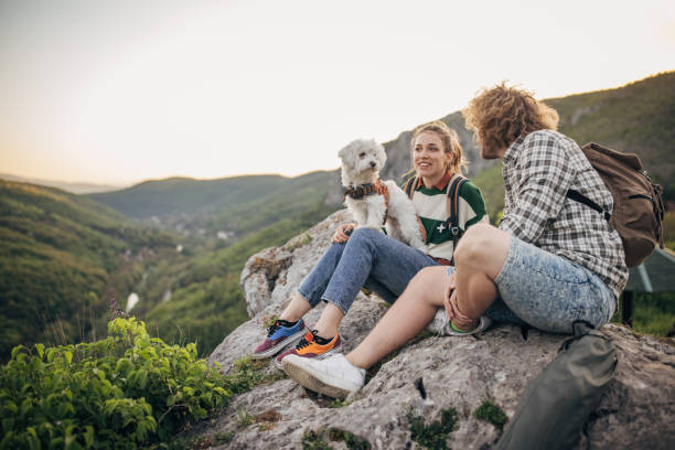 istock Couple relaxing on mountain 1396401696