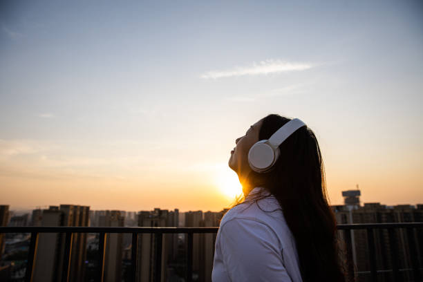 istock listening to music at sunset 1396404739