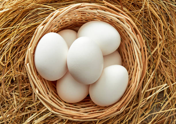 istock Wooden basket with fresh eggs 1396405771