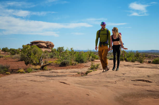 Couple hiking  in Moab park, Utah