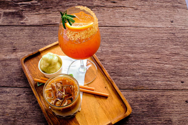 istock Fresh summer drink mocktail pour in glass on wooden plate. 1396408752