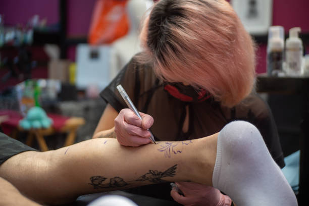 istock Drawing the template of a tattoo 1396409352