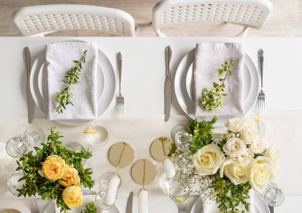 istock The wedding table setting, top view. Wedding teble decoration with white roses and boxwood 1396410981
