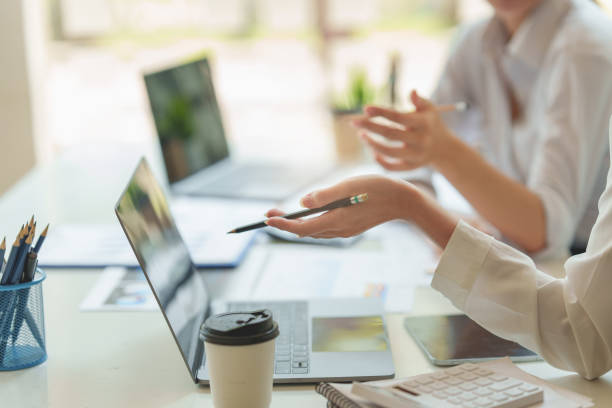 istock Group of IT consultant working by digital tablet and management big data and analyze financial document of company. 1396414323