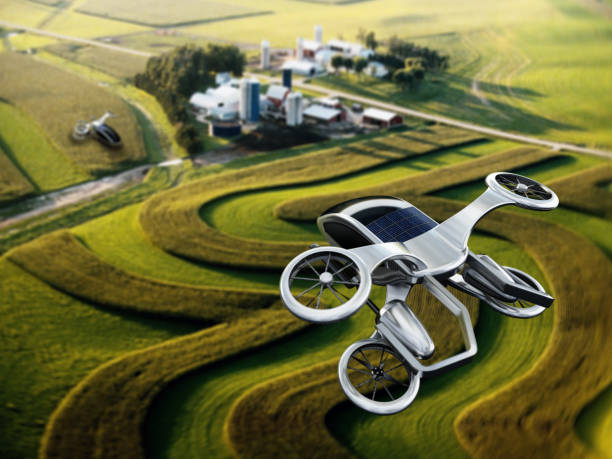 Conceptual eVTOL (electric vertical take-off and landing) aircraft flying over rural areas stock photo
