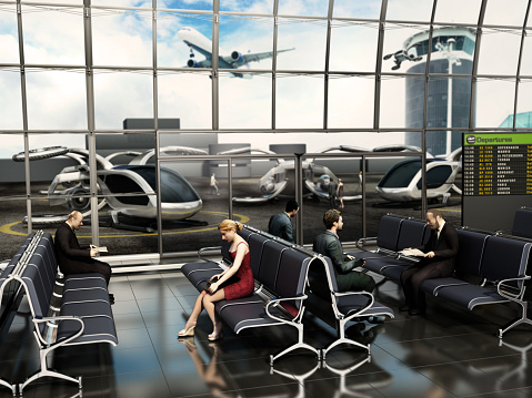 People waiting for eVTOL (electric vertical take-off and landing) aircrafts inside airport lounge.