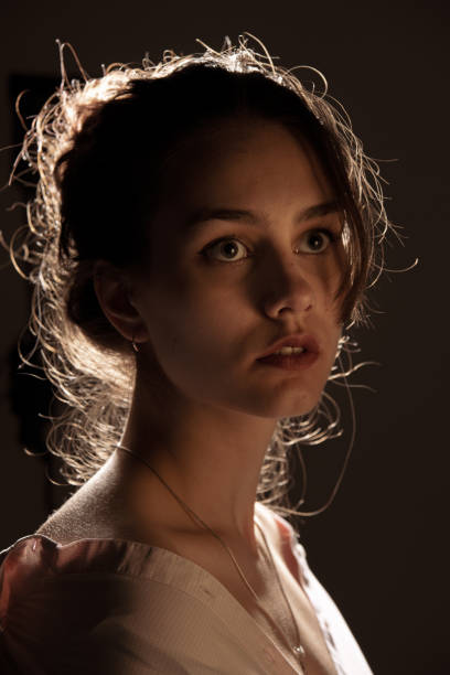 istock Beautiful woman portrait in warm light 1396417886
