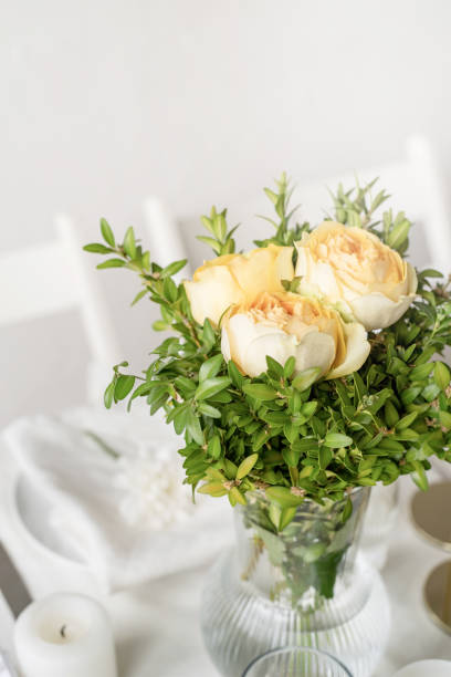 istock The wedding decor. Wedding teble decoration with beige roses, closeup 1396418101