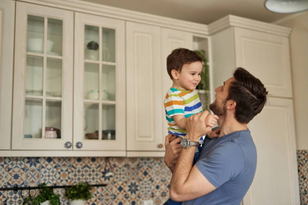 istock Young man spending quality time with his adorable son at home 1396419287