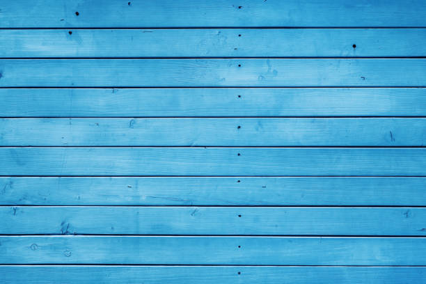 Blue wooden flooring deck planks as background, top view texture