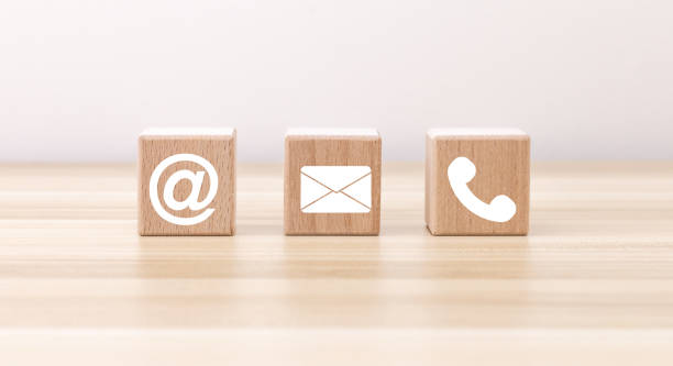 istock Banner of contact us icon (phone, email, mail ) on wood cube, customer service and support for self quarantine business working at home for Coronavirus or virus preventing concept 1396420577