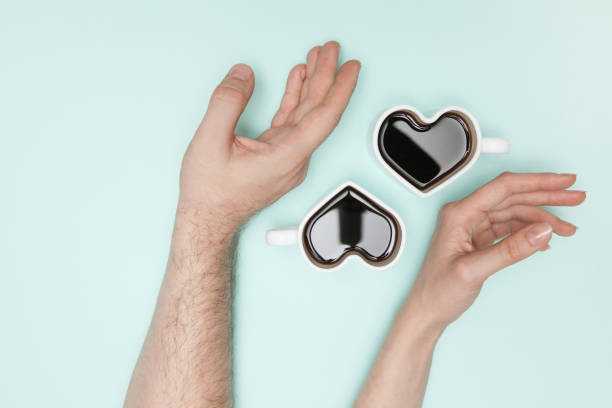 istock Woman's hands and heart shaped cup of coffee. 1396420685
