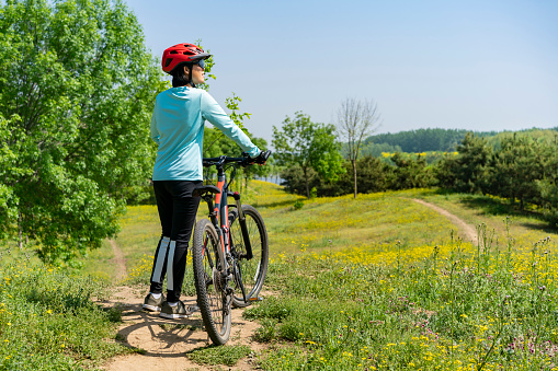 Young woman riding a mountain bike