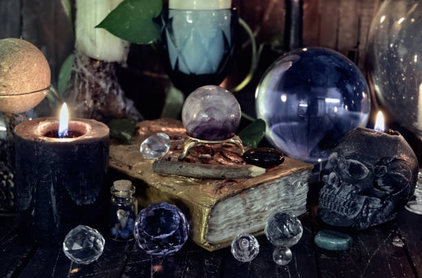 Wicca, esoteric and occult still life with vintage magic objects on witch table altar for mystic rituals and fortune telling. Halloween and gothic concept stock photo