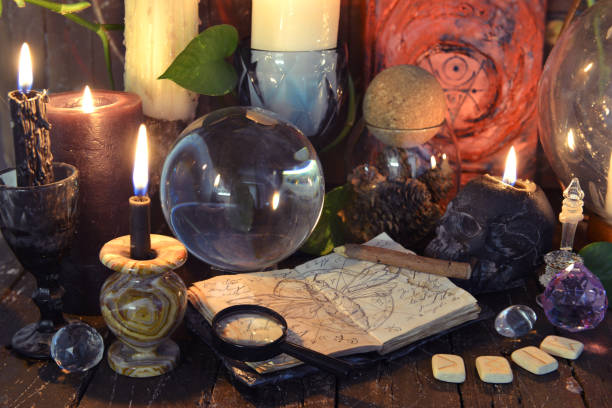 istock Wicca, esoteric and occult still life with vintage magic objects on witch table altar for mystic rituals and fortune telling. Halloween and gothic concept 1396421008
