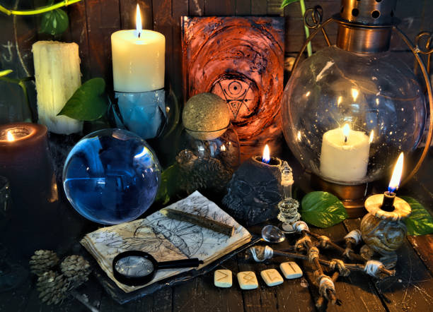 istock Wicca, esoteric and occult still life with vintage magic objects on witch table altar for mystic rituals and fortune telling. Halloween and gothic concept 1396421044