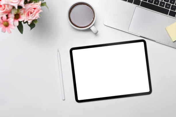 istock Mock up digital tablet, notepad, stylus pen and wireless on white office desk. 1396421244