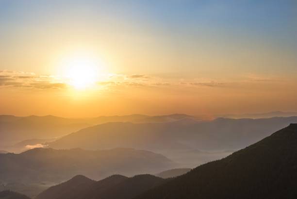 istock beautiful sunrise in a mountains 1396422238
