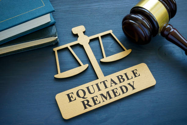 istock Plate with phrase Equitable remedy and a gavel. 1396422289