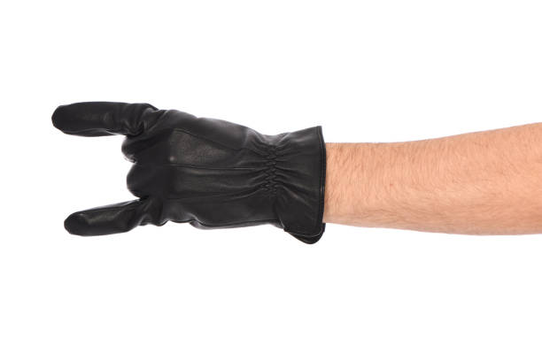 istock Man wearing black leather glove on white background, closeup. 1396422295