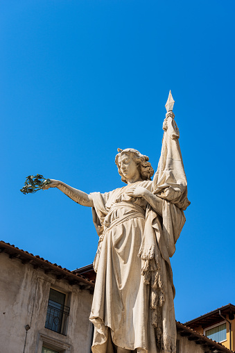 Close-up of marble statue of beauty Italy (Bella Italia), 1864, monument to the fallen of the 10 days of Brescia. By the Italian sculptor Giovanni Battista Lombardi (1822-1880). Brescia downtown, Piazza della Loggia, Lombardy, Italy, Europe.