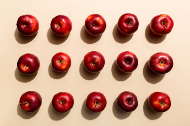 istock Many red apples on colored background, top view. Autumn pattern with fresh apple above view 1396427622