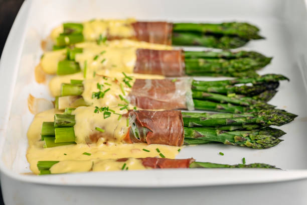 istock Asparagus Wrapped With Parma Ham and Hollandaise Sauce. 1396427731