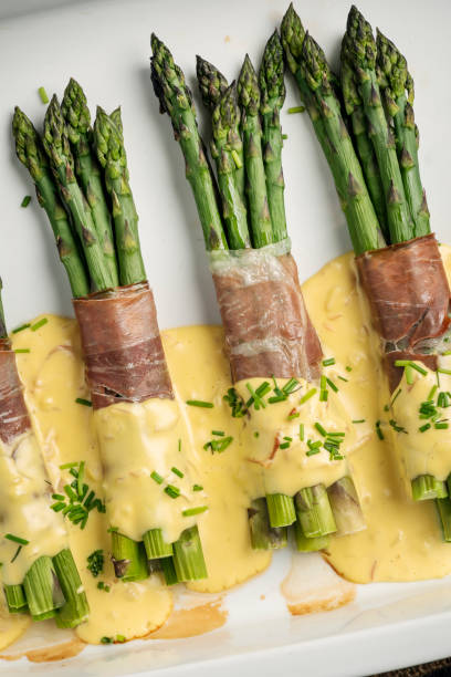istock Asparagus Wrapped With Parma Ham and Hollandaise Sauce. 1396427752