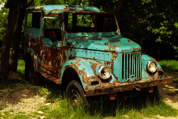 Old car abandoned in the woods
