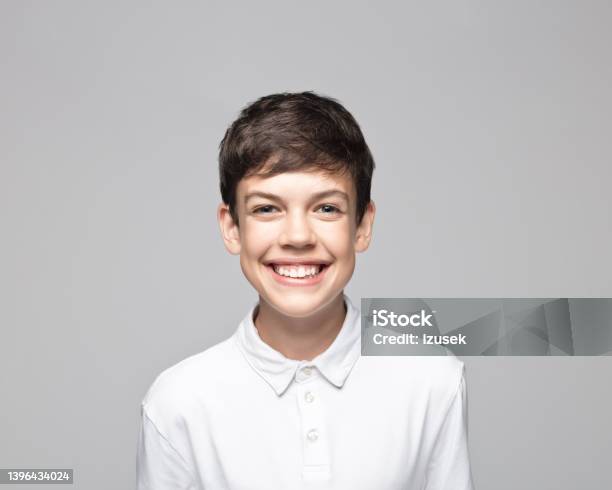 Happy Teenage Boy Against Gray Background Stock Photo - Download Image Now - Teenage Boys, Colored Background, Cut Out