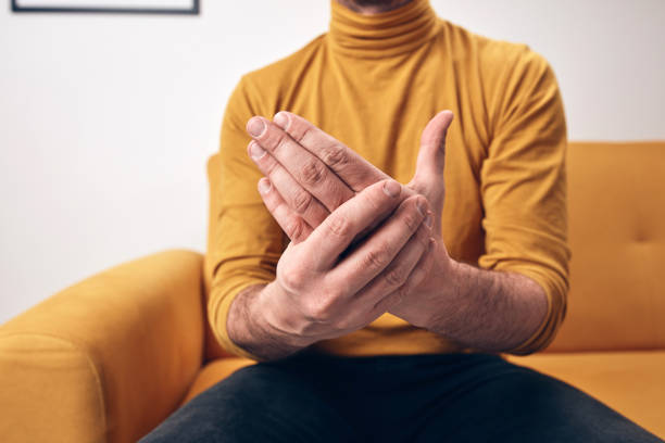 istock Adult man with hand and wrist pain. 1396434607
